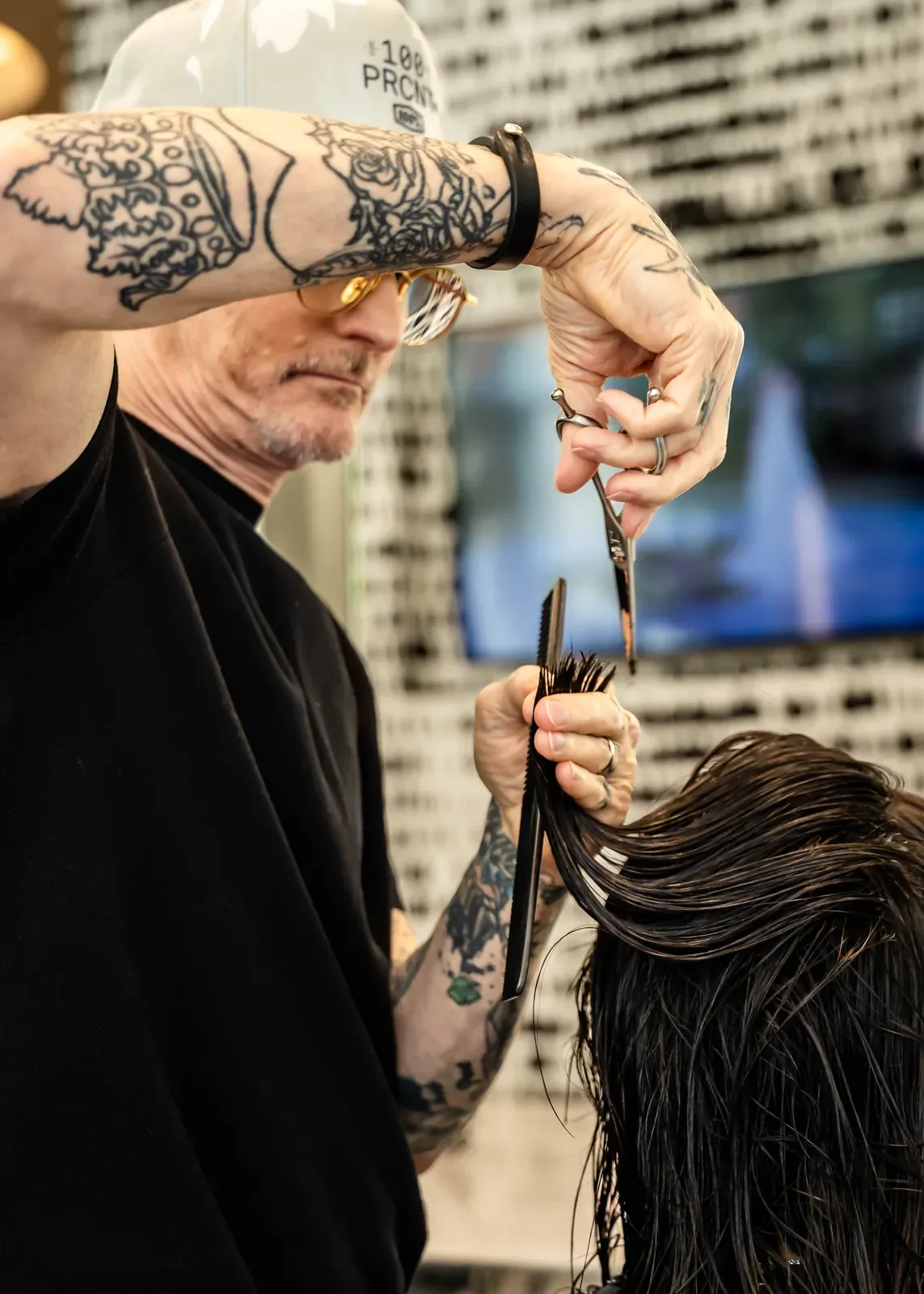 James Fojt cutting hair by hand with shears, close detail