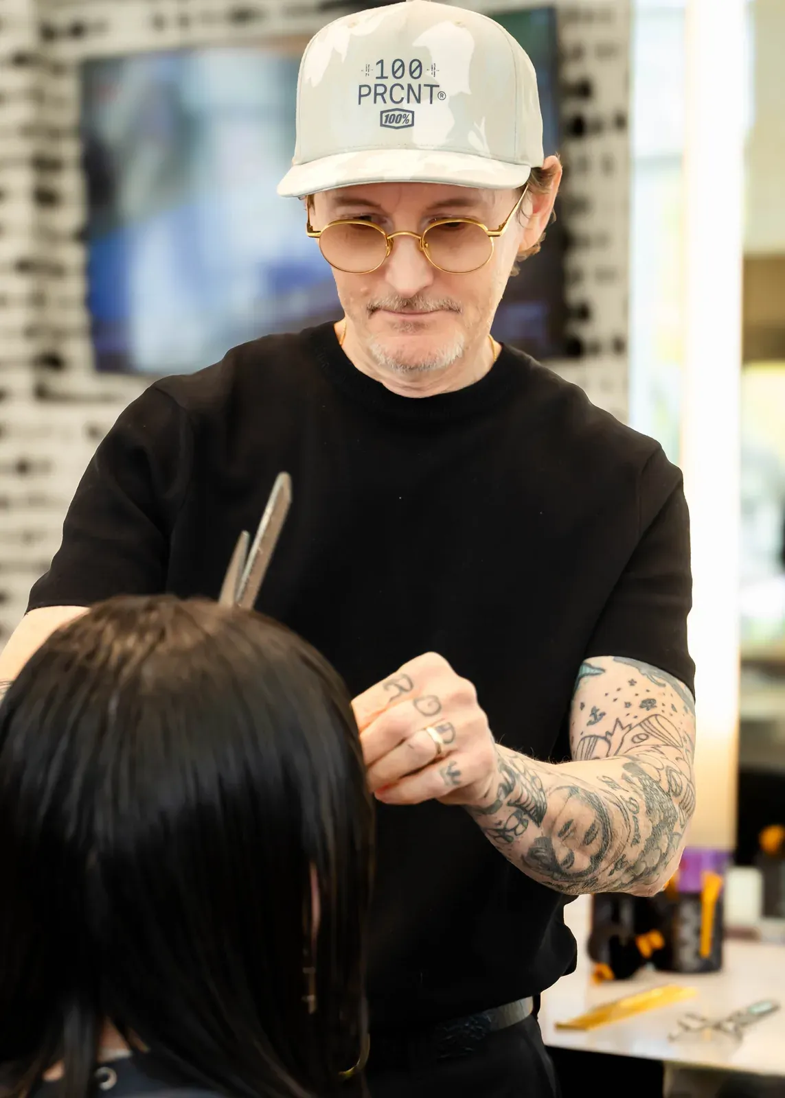 James Fojt cutting a client's hair at Ceron Hair Studio, Houston