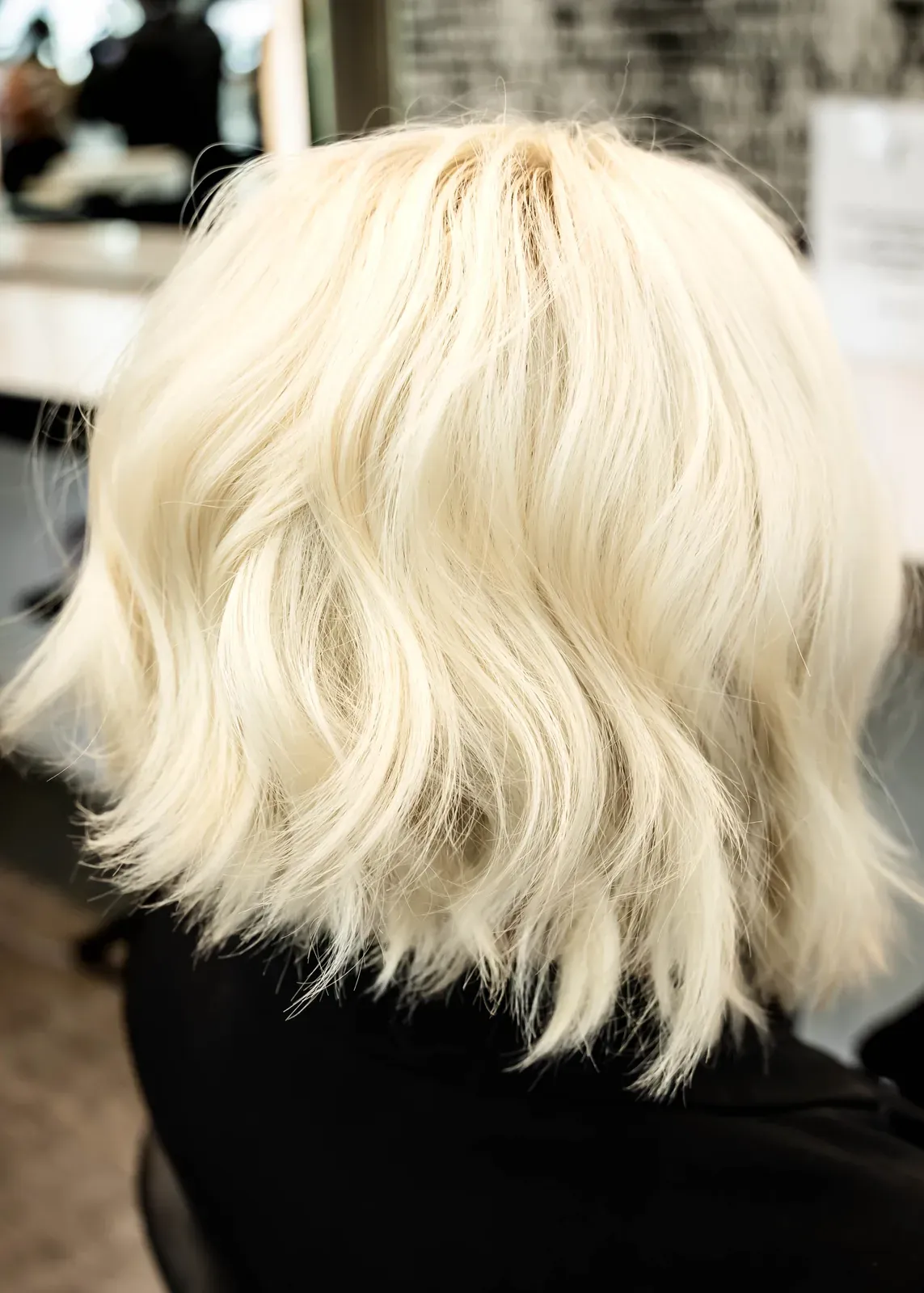 Hand-painted blonde balayage by James Fojt, shown from behind